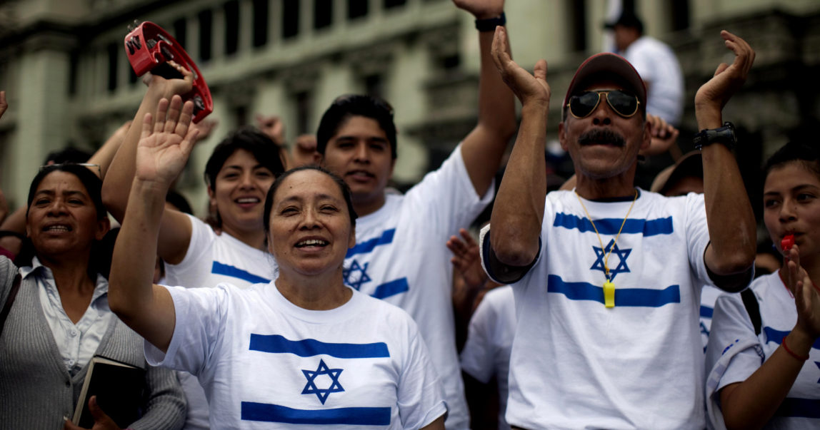 People wearing T-shirts with the Israeli flag demonstrate during a protest against Guatemala's President Alvaro Colom decision of supporting the creation of a Palestinian state, Guatemala City, Oct. 3, 2011. (AP/Rodrigo Abd)