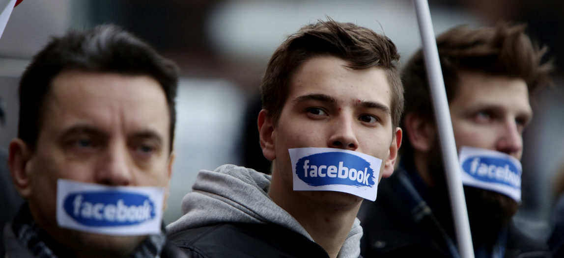 Supporters of a right-wing group protest against censorship after their events, groups and profiles were blocked by Facebook in front of the Facebook Office in Warsaw, Poland, Nov. 5, 2016. (AP/Czarek Sokolowski)