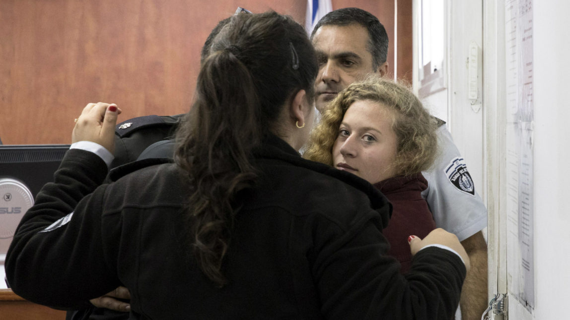 Ahed Tamimi Is escorted to a military court near occupied Jerusalem, Dec. 20, 2017. (AP/Oren Ziv)