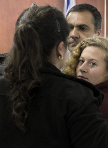Ahed Tamimi Is escorted to a military court near occupied Jerusalem, Dec. 20, 2017. (AP/Oren Ziv)