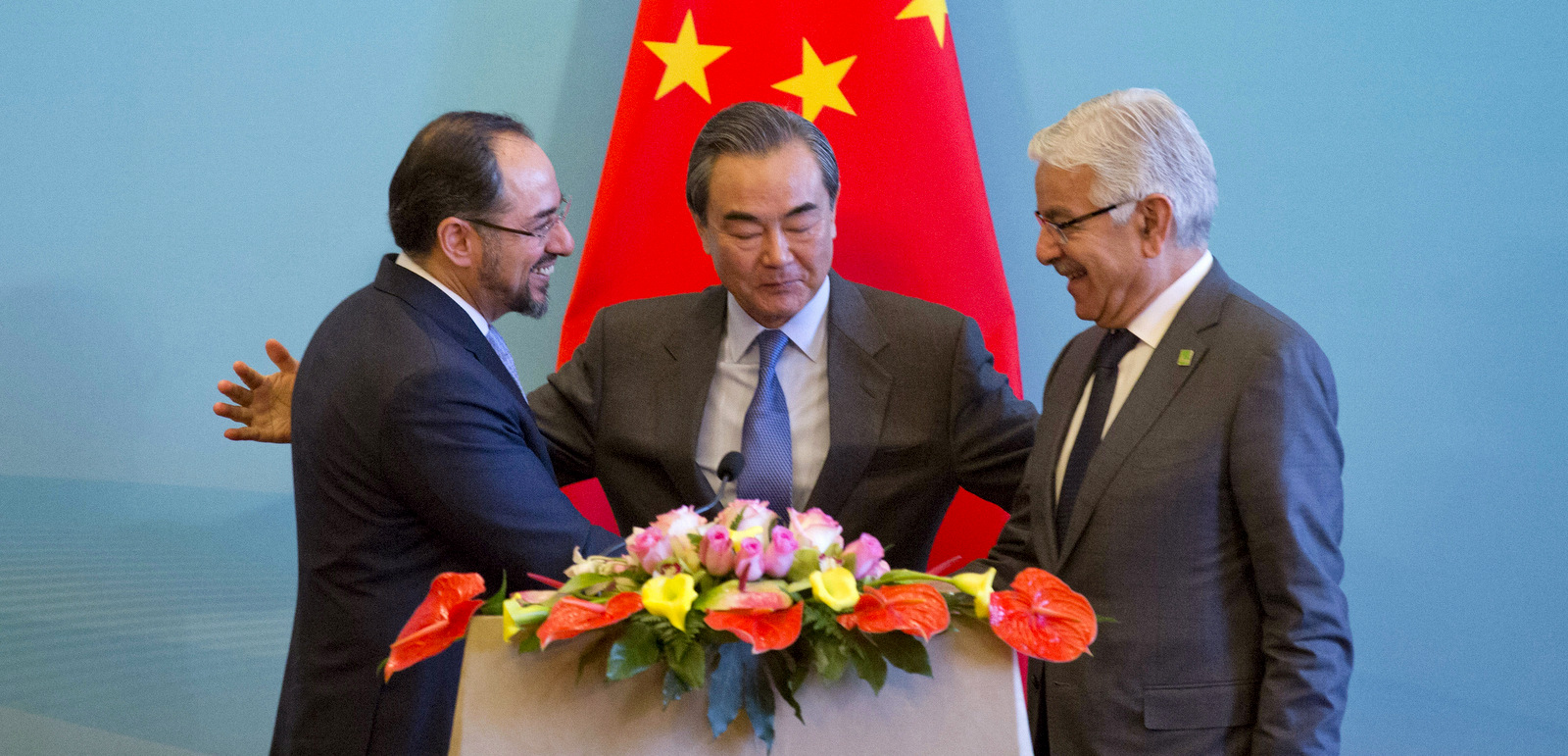 From left, Afghanistan Foreign Minister Salahuddin Rabbani, Chinese Foreign Minister Wang Yi and Pakistani Foreign Minister Khawaja Asif shake hands after a press conference for the 1st China-Afghanistan-Pakistan Foreign Ministers' Dialogue held in Beijing, China, Dec. 26, 2017. (AP/Ng Han Guan)