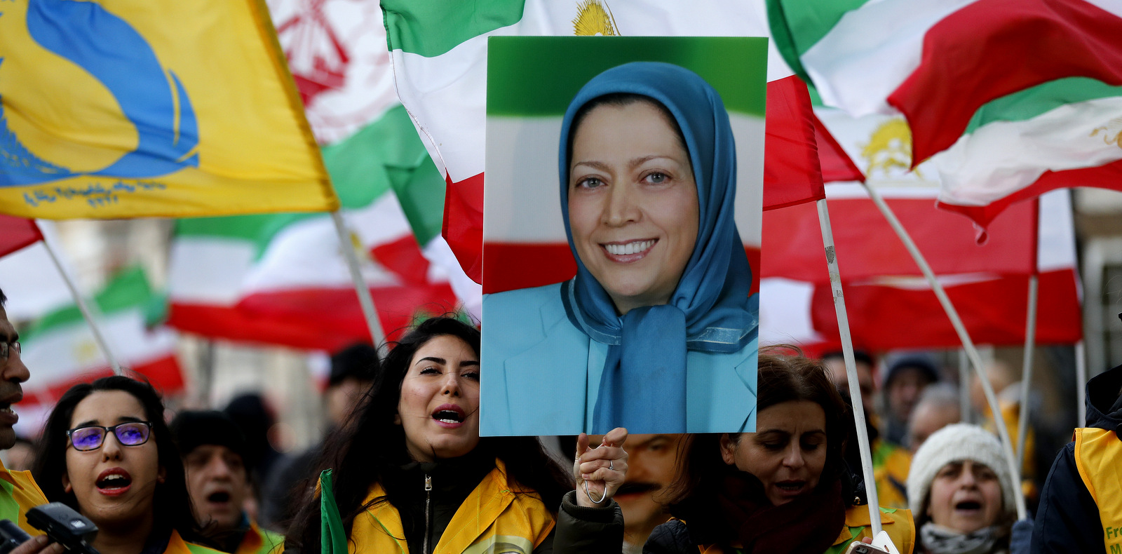 Supporters of Iran's National Council of Resistance of Iran (NCRI) hold a rally opposite the entrance of 10 Downing Street in London, Jan. 4, 2018, the woman pictured is former MEK leader Maryam Rajavi. (AP/Frank Augstein)