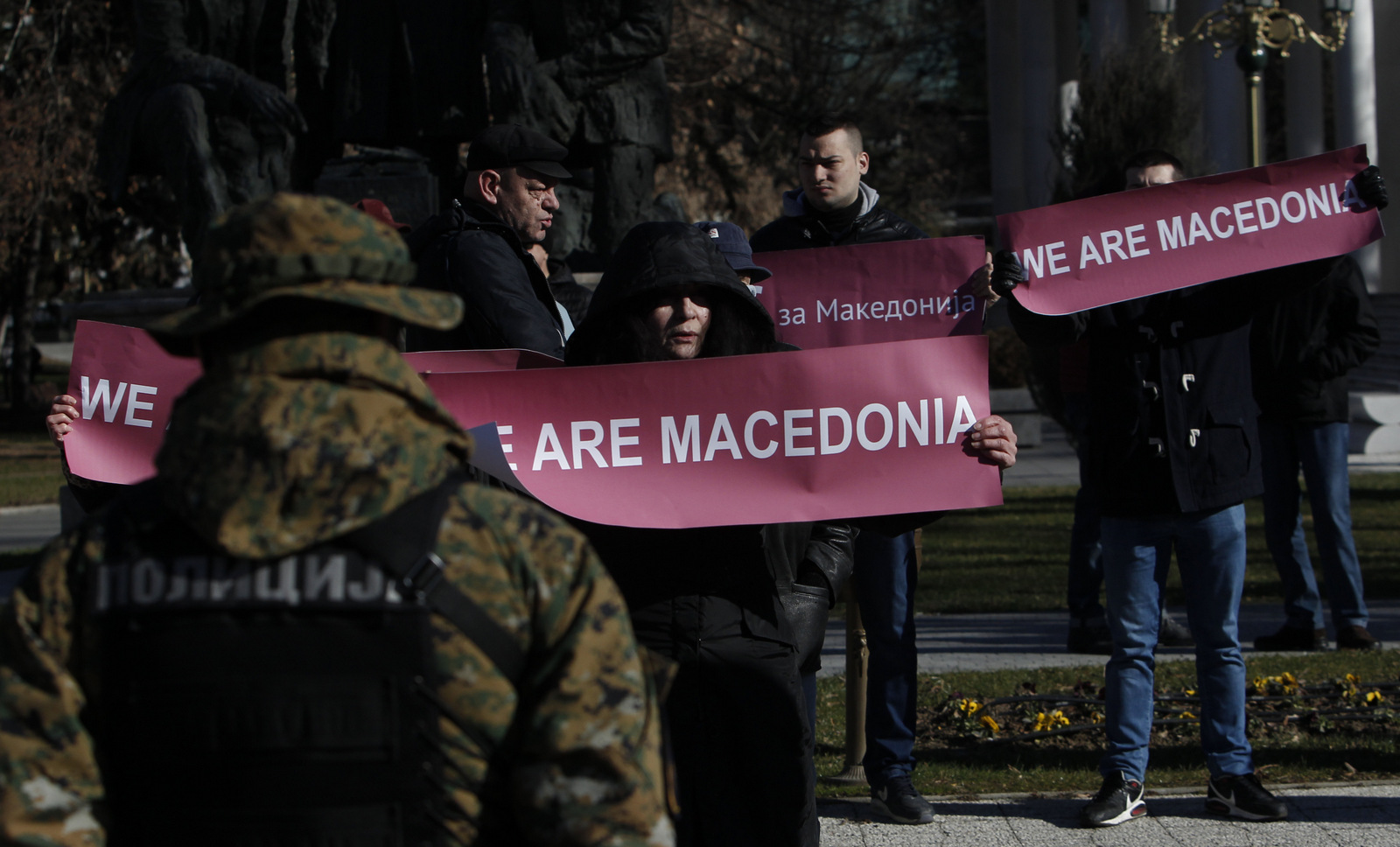 A group of people hold banners reading "We are Macedonia" during anti NATO protest in front of the Parliament in Skopje, Macedonia, while NATO Secretary General Jens Stoltenberg addressed lawmakers in Parliament, Jan. 19, 2018. (AP/Boris Grdanoski)