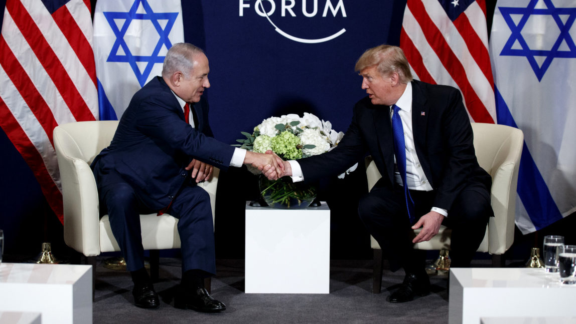 President Donald Trump shakes hands with Israeli Prime Minister Benjamin Netanyahu during a meeting at the World Economic Forum, Jan. 25, 2018, in Davos. (AP/Evan Vucci)