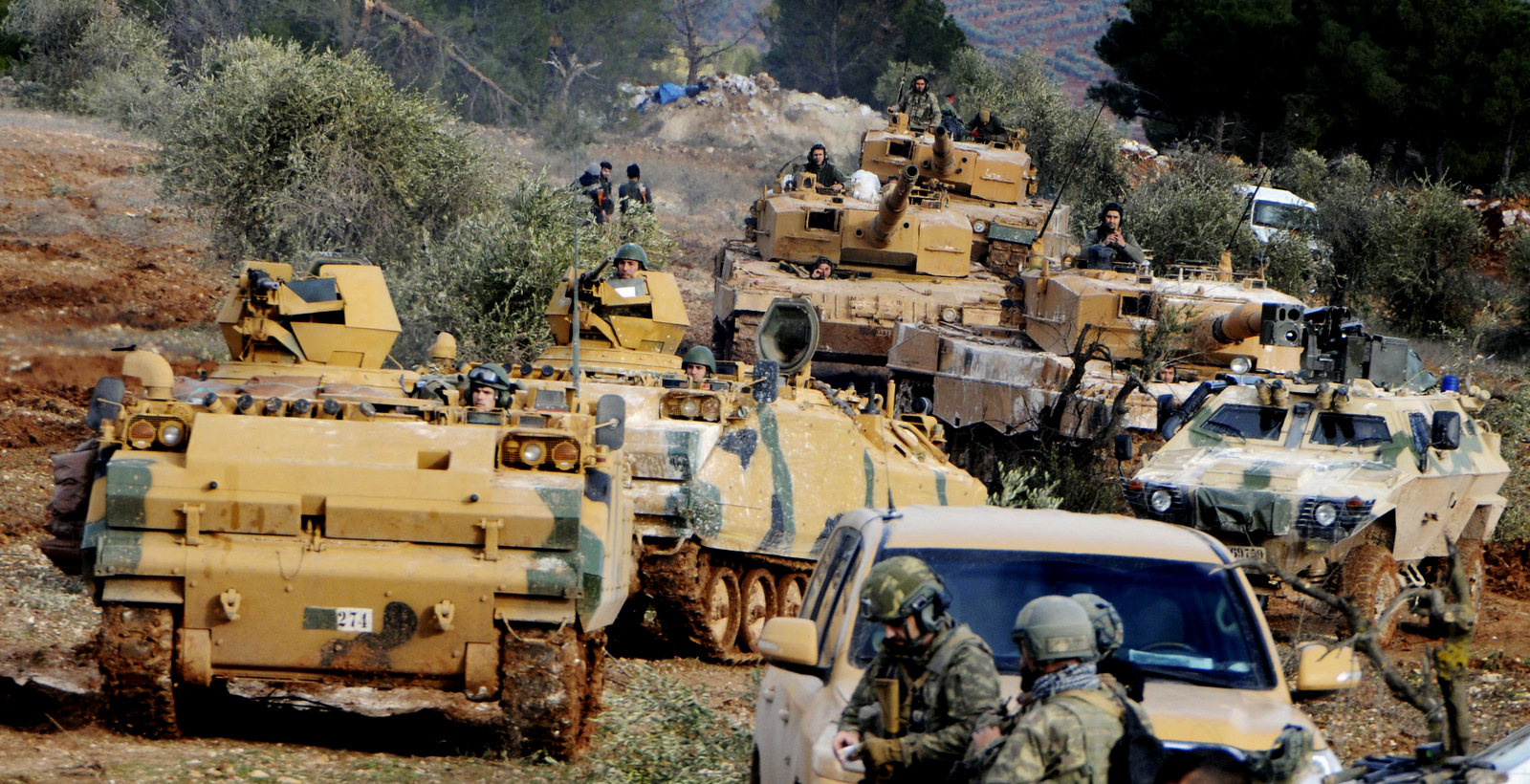 Turkish troops take control of Bursayah hill, which separates the Kurdish-held enclave of Afrin from the Turkey-controlled town of Azaz, Syria, Jan. 28, 2018. (DHA-Depo Photos via AP)