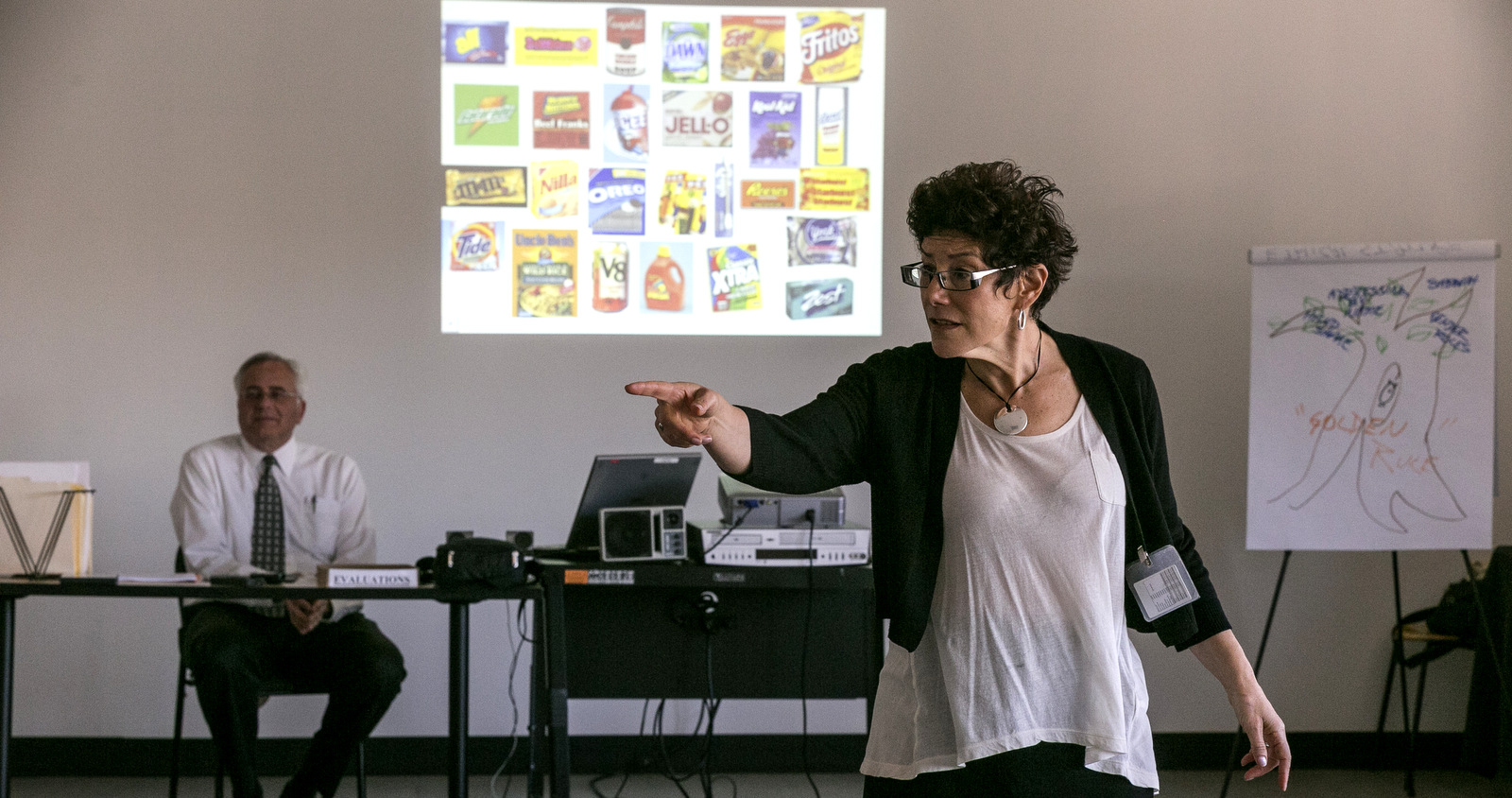 Former LAPD officers Don Wynne, left, and Ann Bozzi instruct Los Angeles Police Department officers to recognize unconscious prejudices and how they can impact behaviors on the street at a class at the Museum of Tolerance in Los Angeles. (AP/Damian Dovarganes)