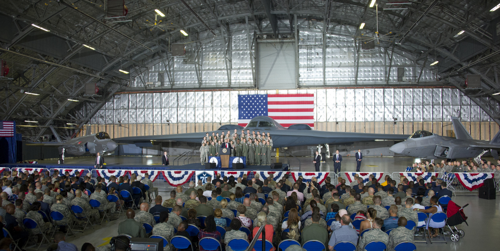 United States President Donald J. Trump delivers remarks to military personnel and families in a hanger at Joint Base Andrews in Maryland on, September 15, 2017. He visited JBA to commemorate the 70th anniversary of the US Air Force. In the background behind the group, from left is a F-35 Joint Strike Fighter, a B-2 Stealth Bomber and a F-22 fighter. (AP Photo)