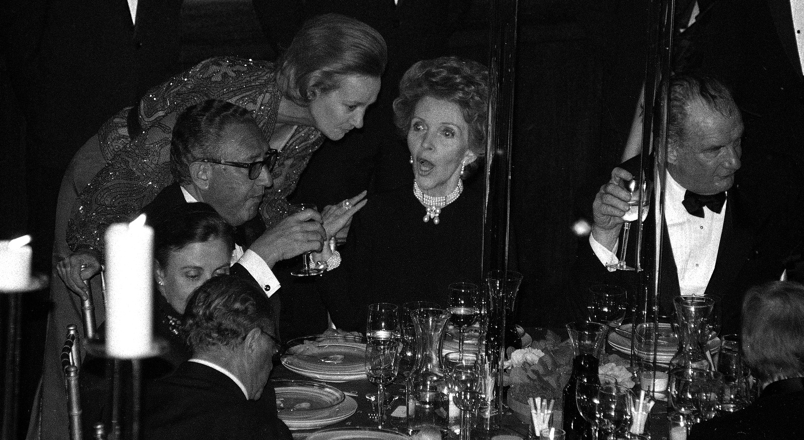 Washington Post publisher Katharine Graham, center, speaks with first lady Nancy Reagan, right, and former U.S. Secretary of State Henry Kissinger, during a gala celebrating the 50th anniversary of Newsweek magazine, Feb. 7, 1983, in New York. (AP/Ray Stubblebine)