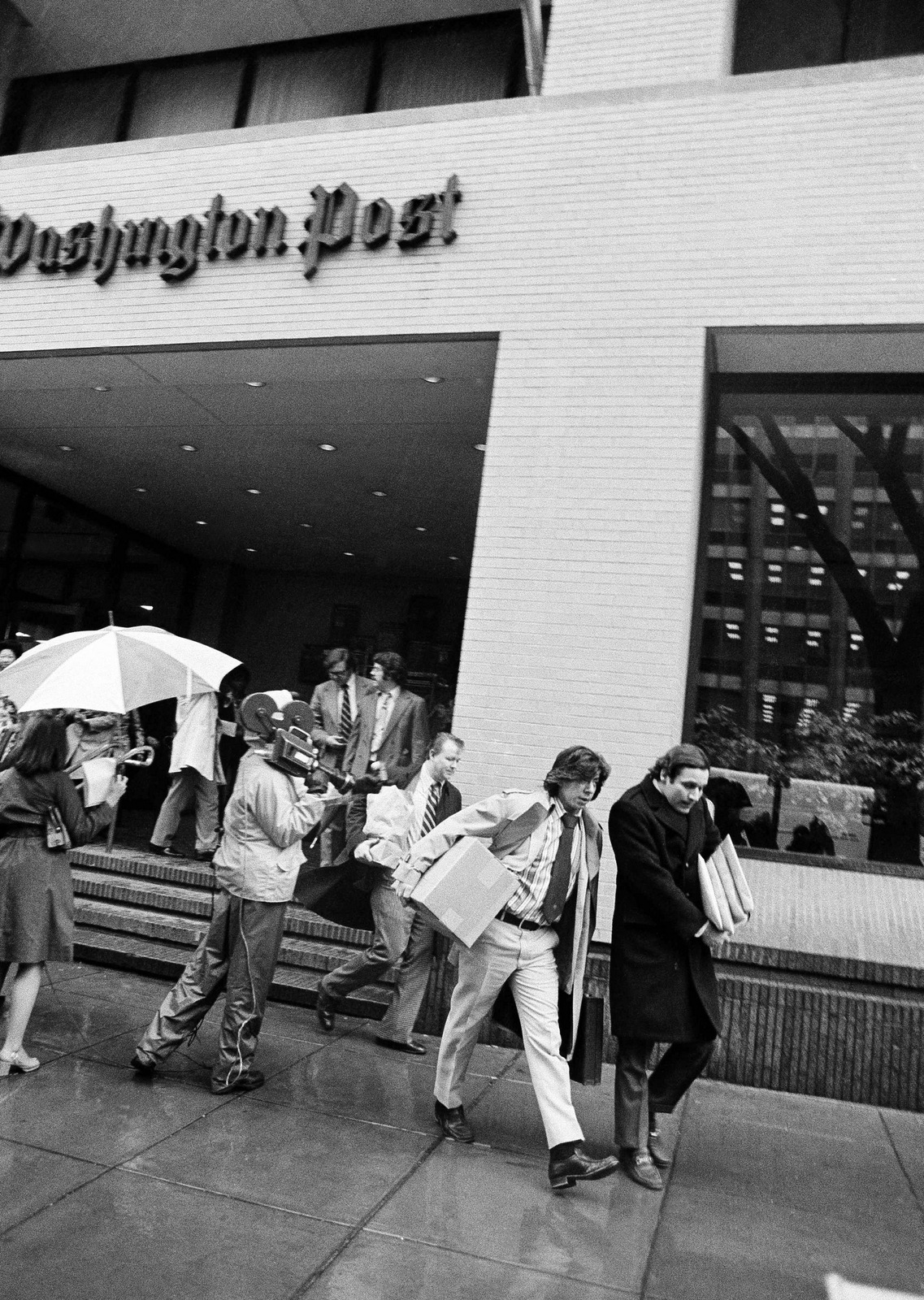 Washington Post reporters Carl Bernstein, left, and Bob Woodward, who uncovered the Watergate scandal, along with other editorial employees, walk off the job at the Post in Washington, April 8, 1974, after Baltimore-Washington arm of the American Newspaper Guild struck the paper. (AP Photo)