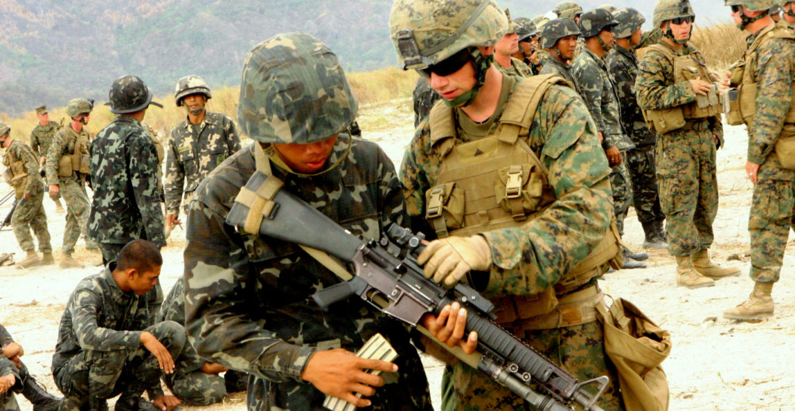 A Republic of the Philippines Marine trains with a U.S. Marine unit, during a small-arms shoot, March 13, 2010.(Photo: U.S. Marine Corp)