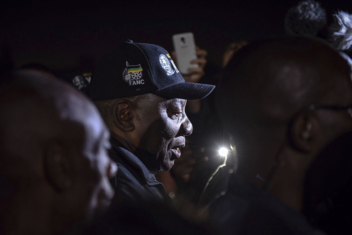 South African President Cyril Ramaphosa, center with black cap, takes a walk from the Guguletu Sports Complex to the Athlone Stadium with members of the community and the general public in Cape Town, South Africa, Tuesday, Feb. 20, 2018.