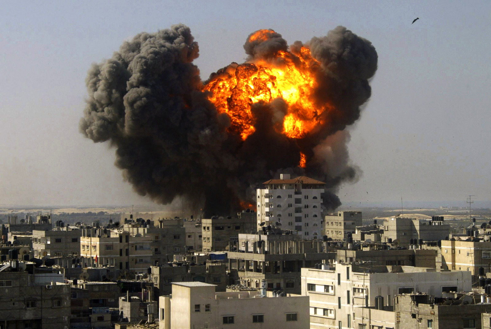 An explosion from an Israeli airstrike is seen in Rafah, in the densly populated Gaza Strip. (AP/Abdalrahem Khateb)