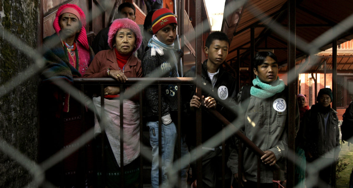 Bhutanese refugees wait to leave for resettlement abroad at a transit facility of International Organization for Migration in Katmandu, Nepal, Dec. 13, 2010. (AP/Binod Joshi)