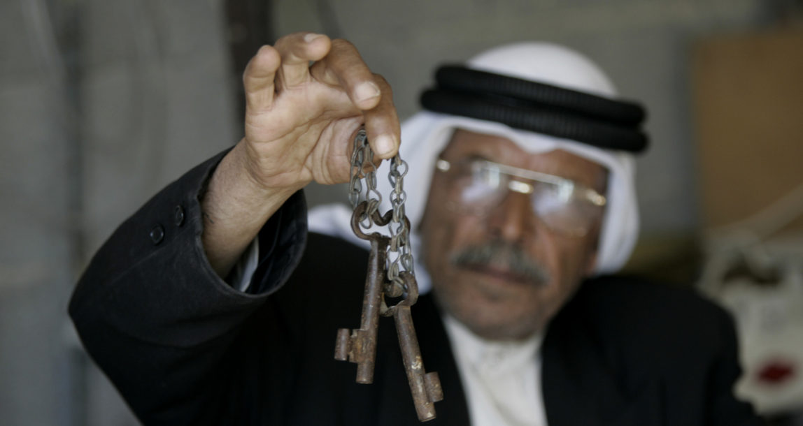 Palestinian refugee Shaher Al-Khatib, 71, holds a handmade symbolic key to his family houses left by relatives in 1948, during a rally marking the 63rd anniversary of the "Nakba", Arabic for catastrophe, in the village of Alberrj near Ramallah. Palestinians mark the day when many thousands were forced to leave their ancestral homes during the creation of the state of Israel in 1948. (AP/Majdi Mohammed)