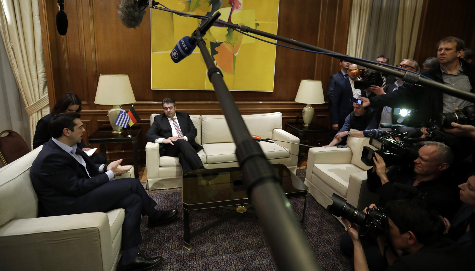 Greece's Prime Minister Alexis Tsipras, left, speaks with German Foreign Minister Sigmar Gabriel during their meeting at Maximos Mansion in Athens, March 22, 2017. Gabriel is in Greece on a two-day visit as he is suggesting his country could offer to pay more money into the European Union, arguing that investing in Europe is "an investment in our own future." (AP/Thanassis Stavrakis)