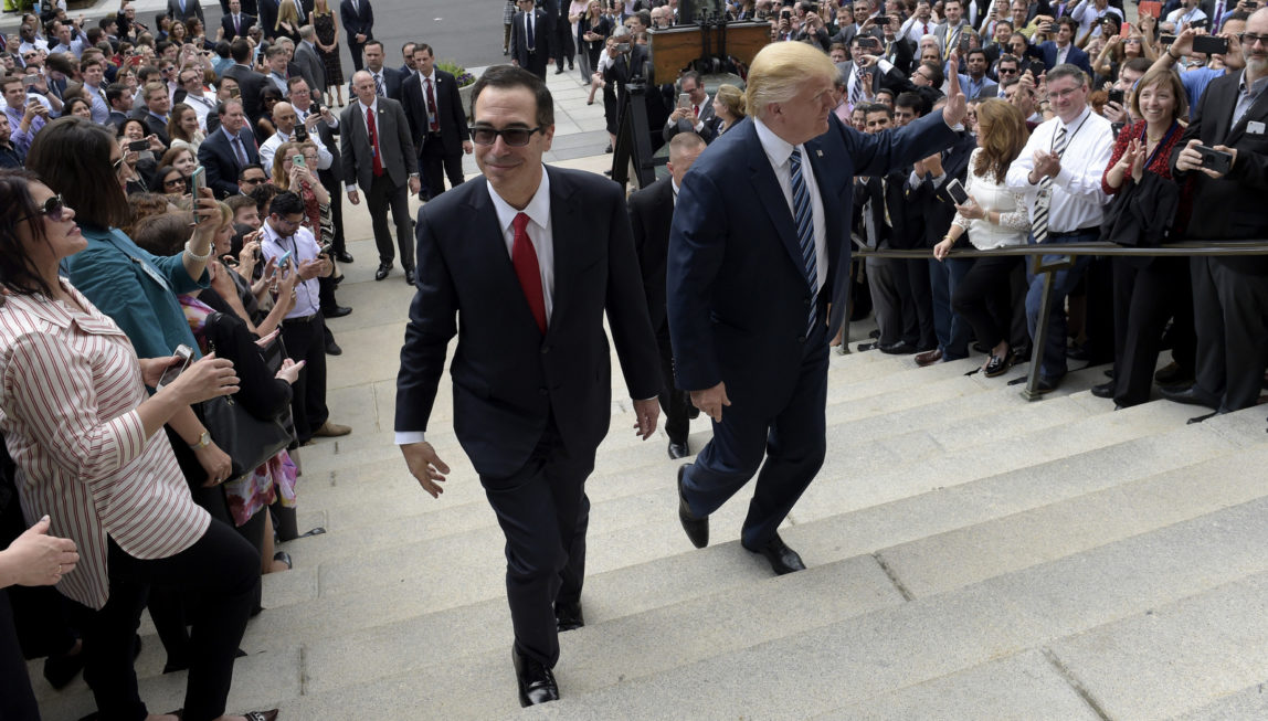 President Donald Trump and Treasury Secretary Steven Mnuchin arrive at the Treasury Department in Washington, April 21, 2017, where the president was to sign an executive order to review tax regulations set last year by his predecessor, as well as two memos to potentially reconsider major elements of the 2010 Dodd-Frank financial reforms passed in the wake of the Great Recession. (AP/Susan Walsh)