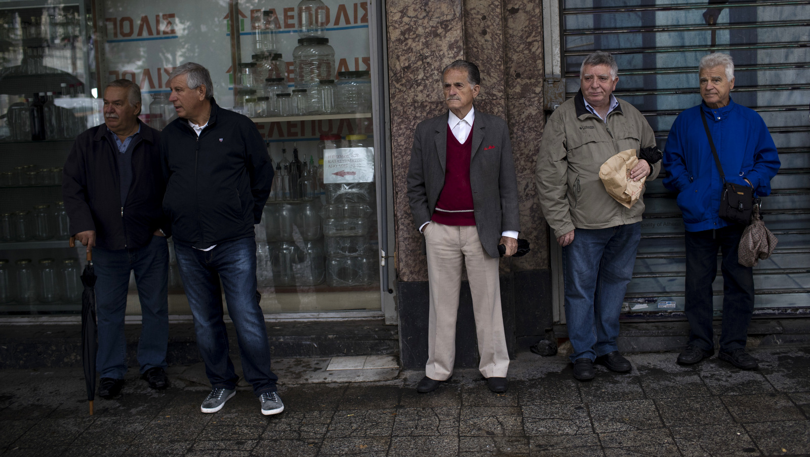Greek pensioners stand with other retirees as they gather to take part in an anti-austerity rally in Athens. Greek retirees are struggling to survive on ever dwindling pensions with repeated cuts imposed by successive governments as part of their country’s three international bailouts. (AP/Petros Giannakouris)