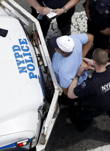 New York City police officers detain and question a man,, July 11, 2017, in the Bronx borough of New York. (AP/Mark Lennihan)