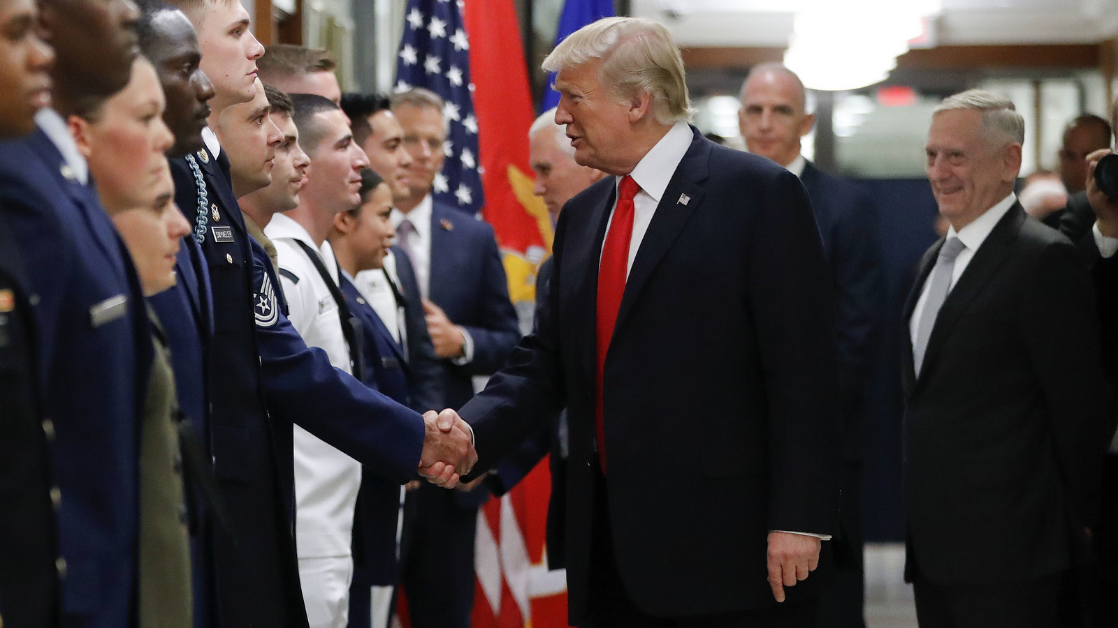 Defense Secretary Jim Mattis looks on as President Donald Trump greets military personnel during a visit to the Pentagon ,July 20, 2017. (AP/Pablo Martinez Monsivais)
