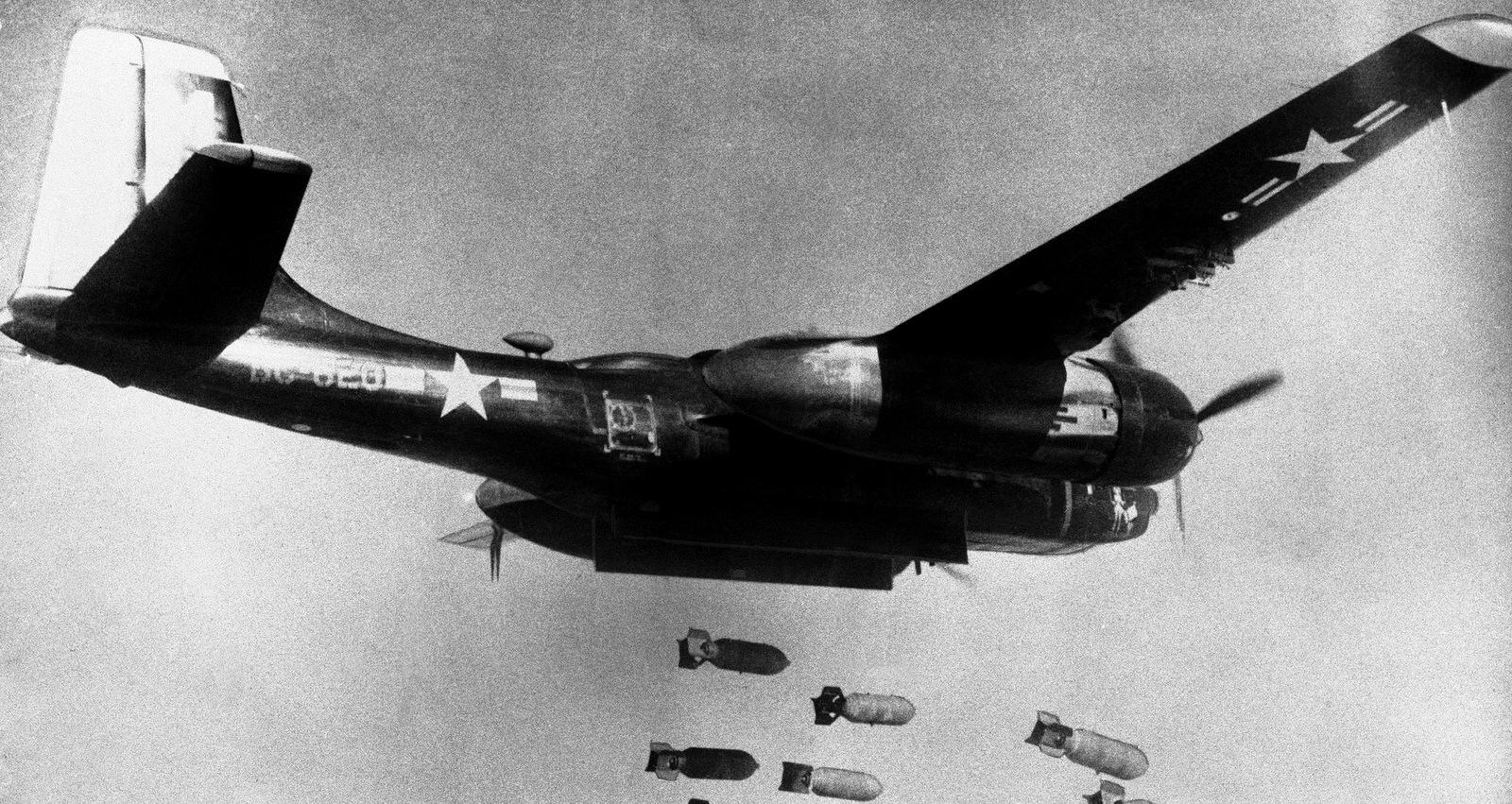 Bombs drop from a U.S. Air Force 3rd bomber wing B26 light bomber somewhere in North Korea. All told, the U.S. dropped 635,000 tons of bombs on Korea during the war, most of it in the North, including with 32,500 tons of napalm, March 18, 1953. (U.S. Air Force via AP)