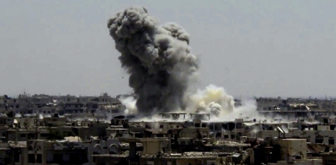 Smoke and debris rising after a Syrian government ground-to-ground rocket strikes the opposition-held town of Ain Terma, in the Eastern Ghouta suburb of Damascus, Syria. (Ghouta Media Center via AP)