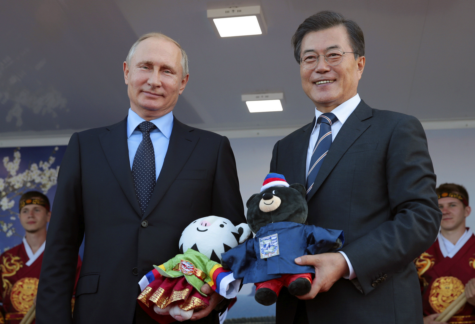 Russian President Vladimir Putin, left, and his South Korean counterpart Moon Jae-in smile and hold stuffed animals representing the 2018 and 2014 Winter Olympics at the Eastern Economic Forum in Vladivostok, Russia, on, Sept. 6, 2017. (Mikhail Metzel/TASS via AP)