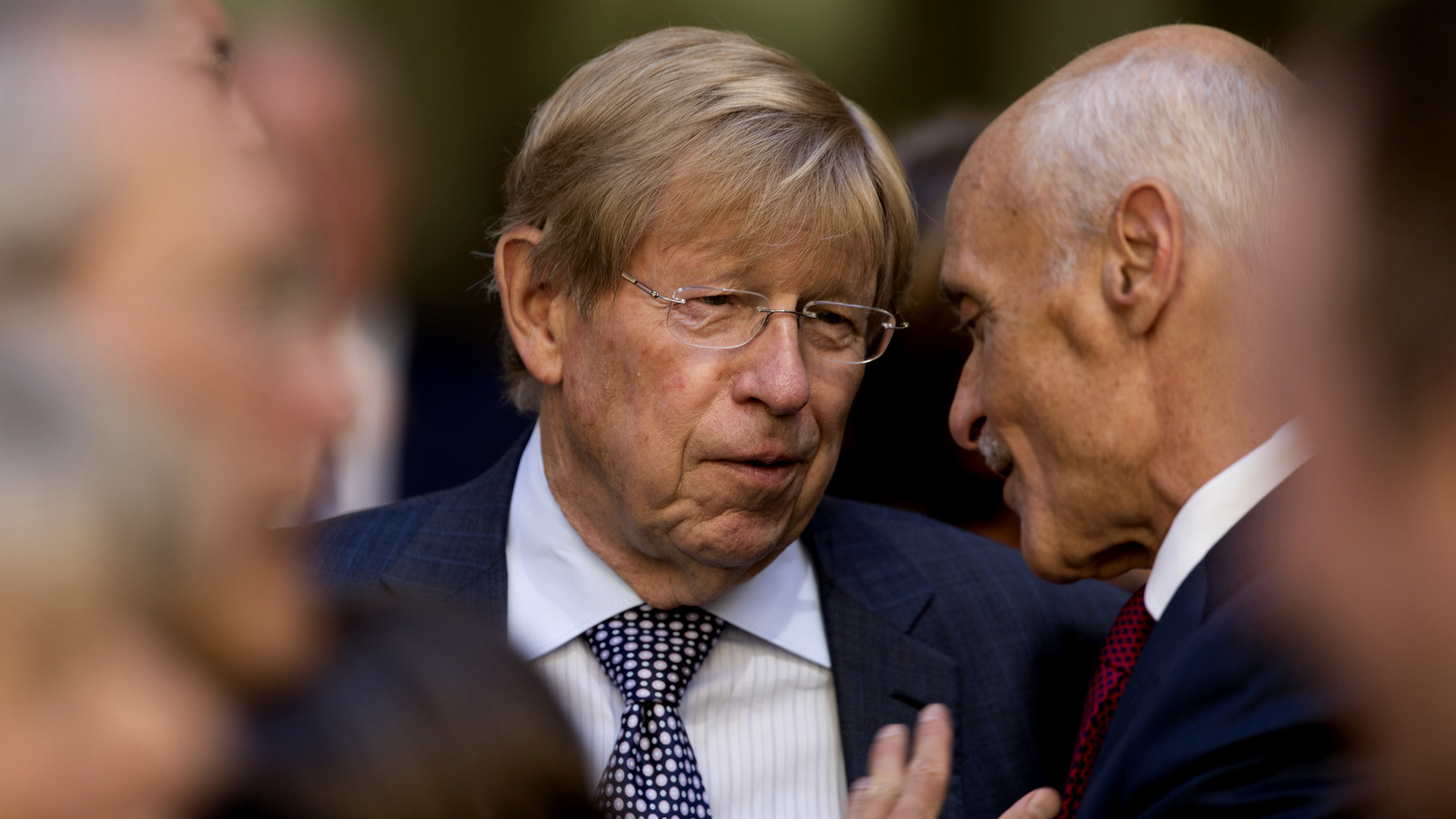 Former United States Solicitor General Ted Olson, center, speaks with former Homeland Security Secretary Michael Chertoff, right, before an installation ceremony for FBI Director Chris Wray at the FBI Building, Sept. 28, 2017, in Washington. (AP/Andrew Harnik)