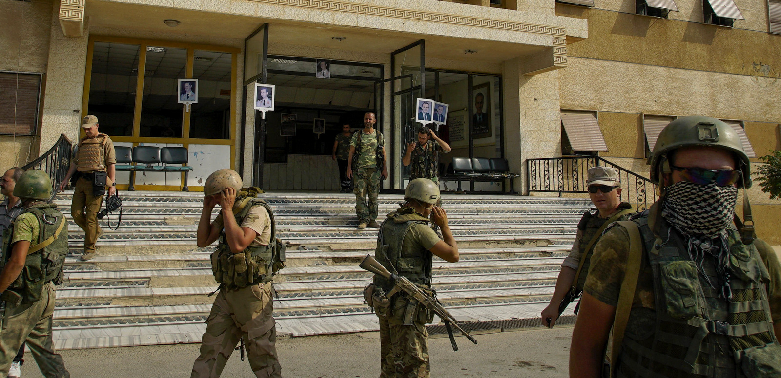 Russian soldiers walk outside a hospital in Deir el-Zor, Syria, Sept. 15, 2017. (AP Photo)