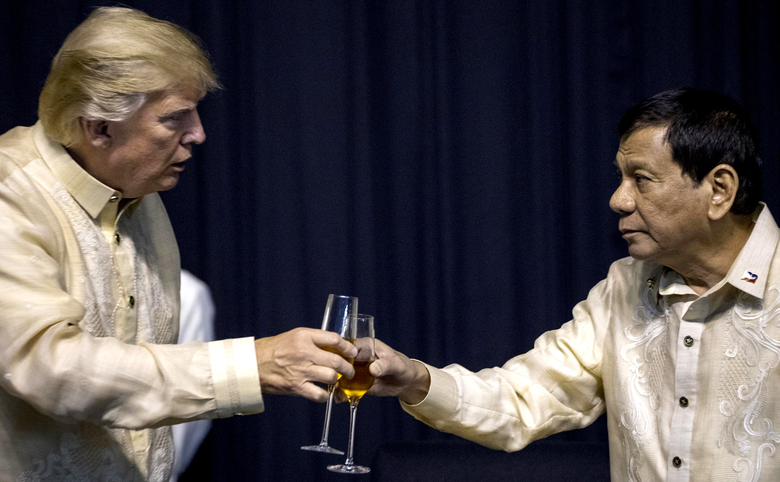 President Donald Trump toasts Philippines President Rodrigo Duterte, right, at an ASEAN Summit dinner at the SMX Convention Center, Nov. 12, 2017, in Manila, Philippines. (AP/Andrew Harnik)