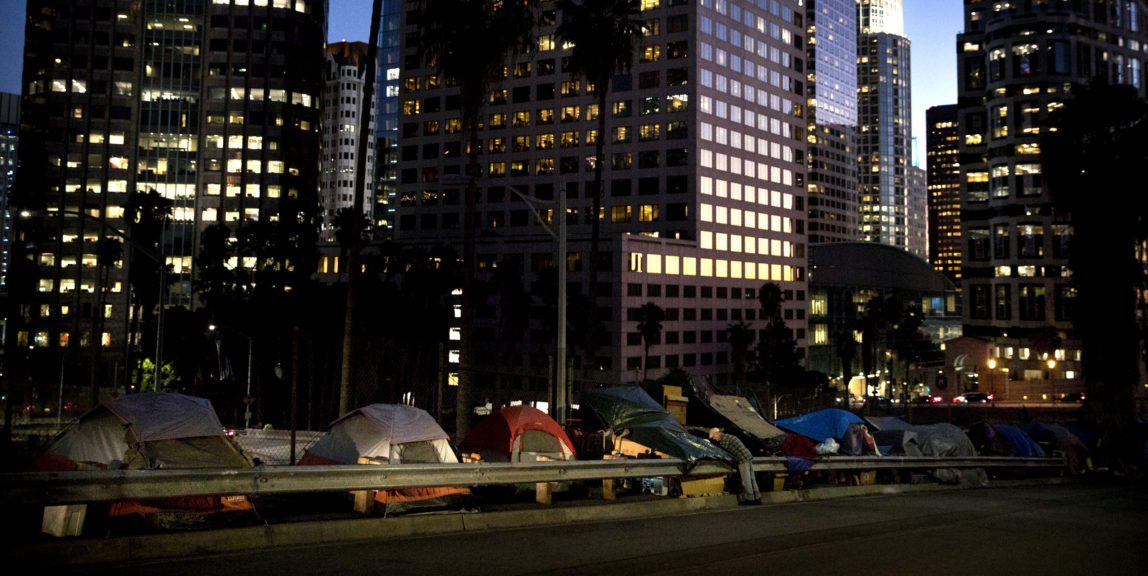Homeless tents are dwarfed by skyscrapers in Los Angeles. (AP Photo/Jae C. Hong)