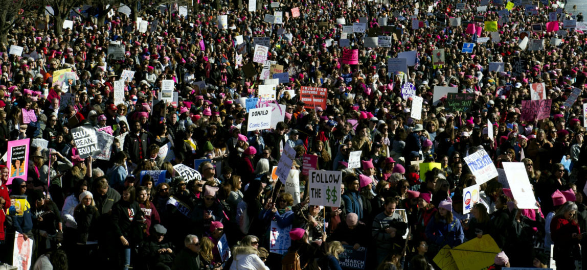 The Capitol and Washington Monument are seen as Women's March demonstrators line the Reflecting Pool at the Lincoln Memorial in Washington, Saturday, Jan. 20, 2018. Activists are returning to the streets a year after millions of people rallied worldwide at marches for female empowerment, hoping to create an enduring political movement that will elect more women to government office. (AP/Cliff Owen)