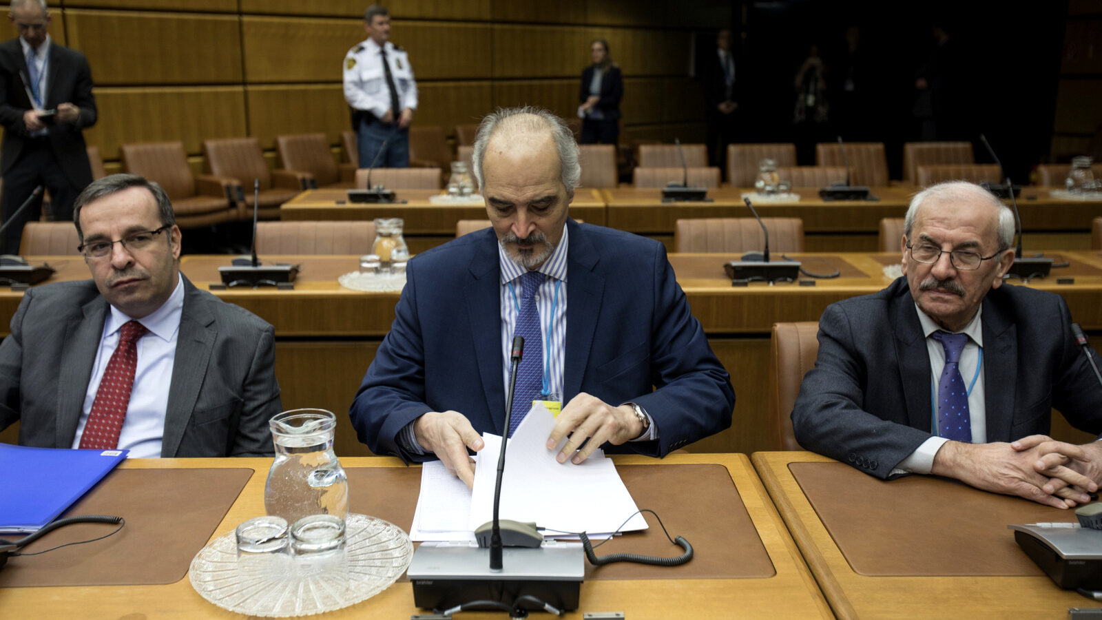 Syrian chief negotiator and Ambassador of the Permanent Representative Mission of Syria to the United Nations, Bashar al-Jaafari, centre, sits sits with members of Syrian delegation before the start of official talks on Syria, in Vienna, Austria, Jan. 25, 2018. (Alex Halada/AP)