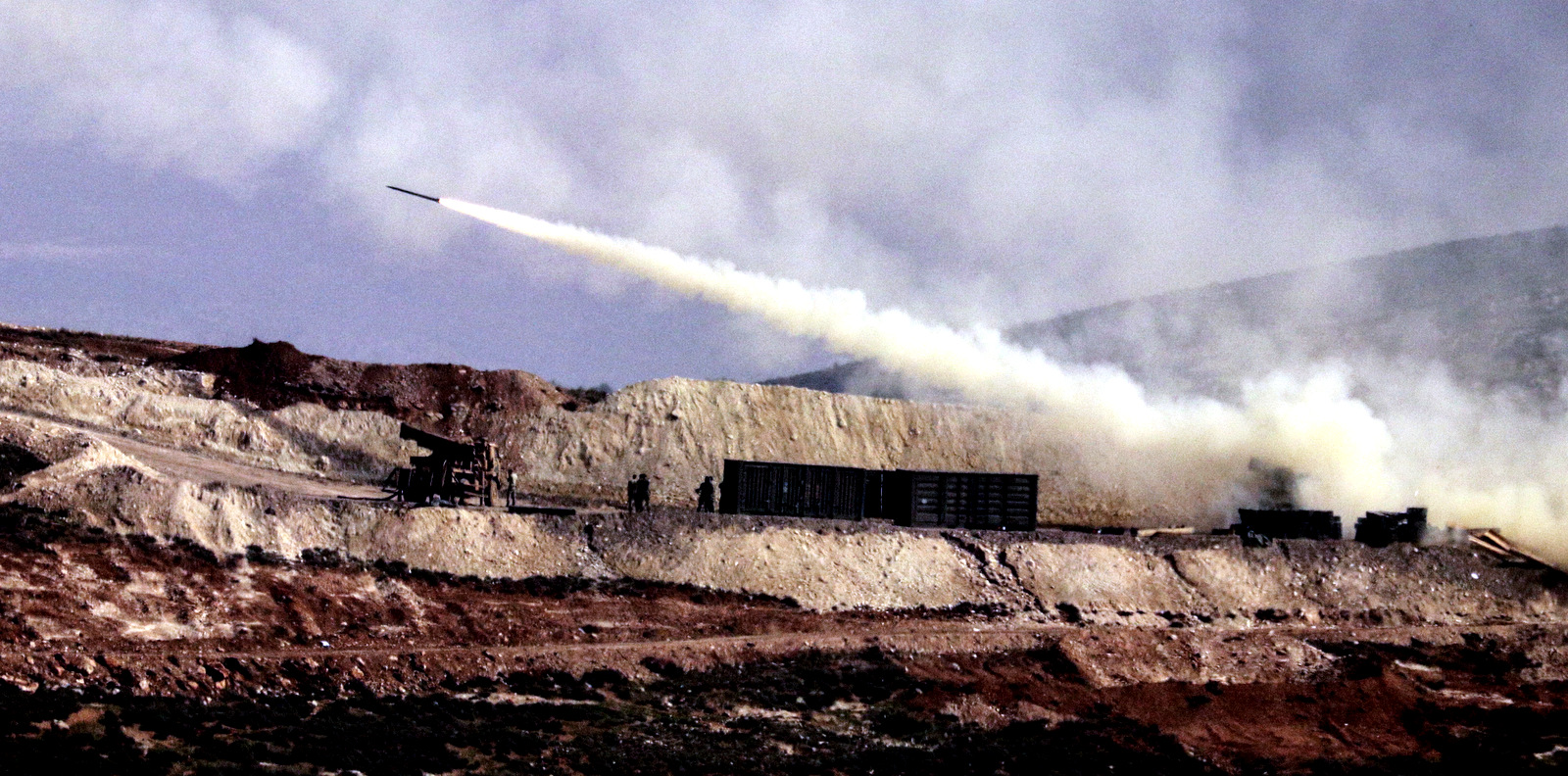 Turkish artillery fires toward Syrian Kurdish positions in Afrin area, Syria, from Turkish side of the border in Hatay, Turkey, Feb. 9, 2018. (AP Photo)