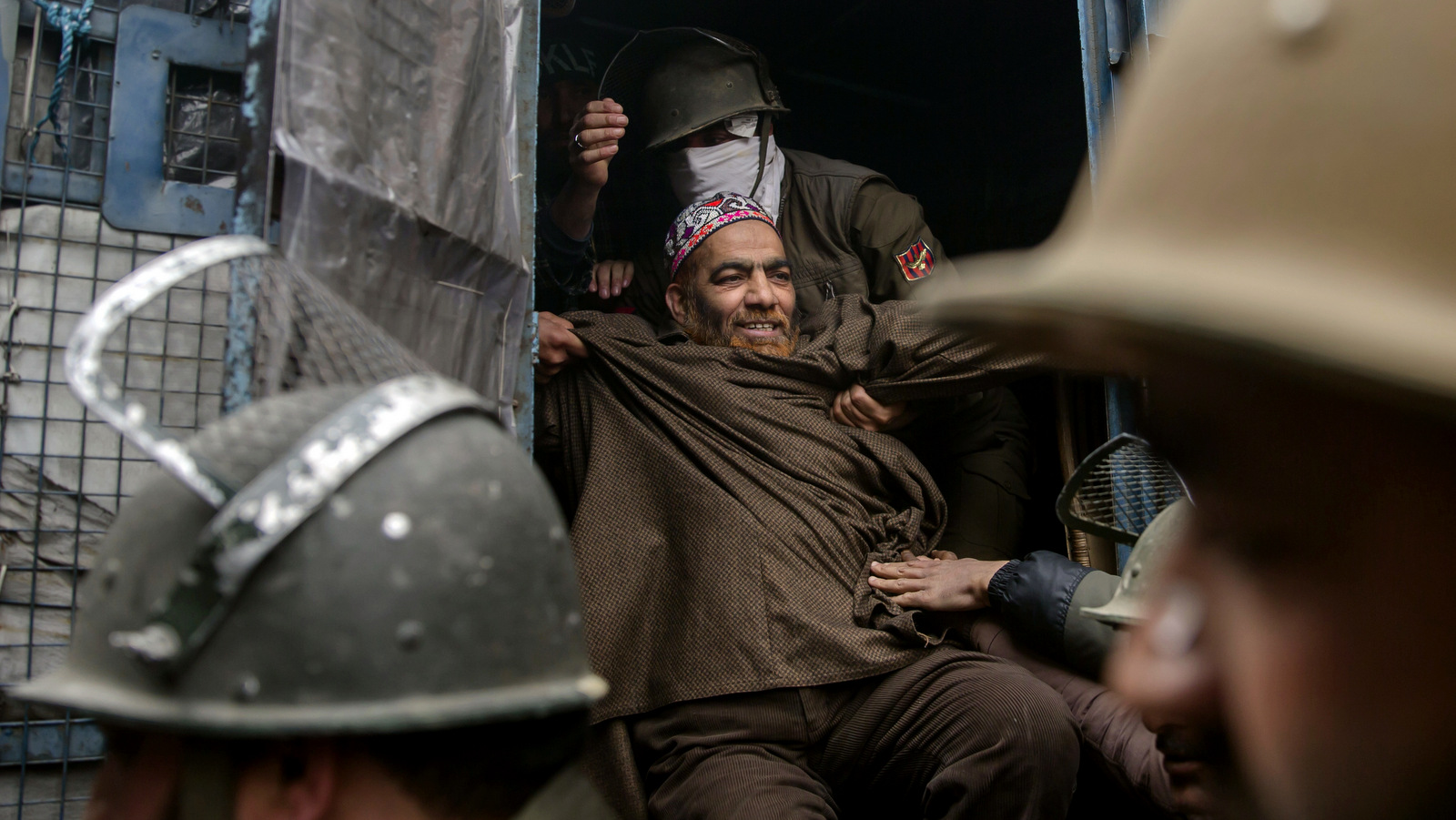 Indian riot police arrest a protester on the anniversary of protest leader Maqbool Bhat in Srinagar, Indian occupied Kashmir, Feb. 11, 2018. Indian authorities imposed a curfew in parts of Kashmir's main city to prevent anti-Indian protests after groups called a general strike demanding Bhat's remains, interred in a New Delhi Jail, be returned for a proper burial. (AP/Dar Yasin)
