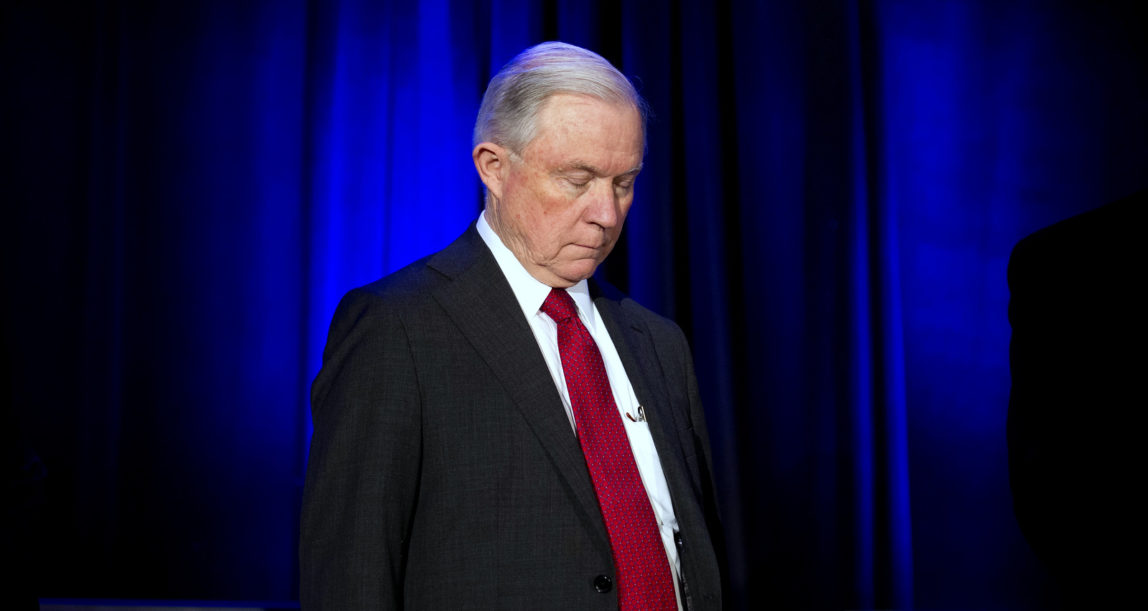 Attorney General Jeff Sessions bows his head during a prayer session prior to addressing the National Sheriffs' Association Winter Conference in Washington, Feb. 12, 2018. (AP/Cliff Owen)