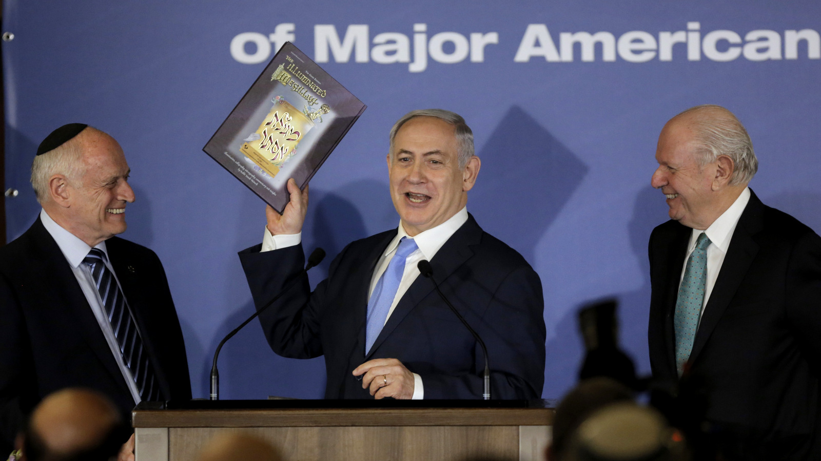 Israeli Prime Minister Benjamin Netanyahu holds a book during a Conference of Presidents of Major American Jewish Organizations in Jerusalem, Feb. 21, 2018. (AP/Sebastian Scheiner)