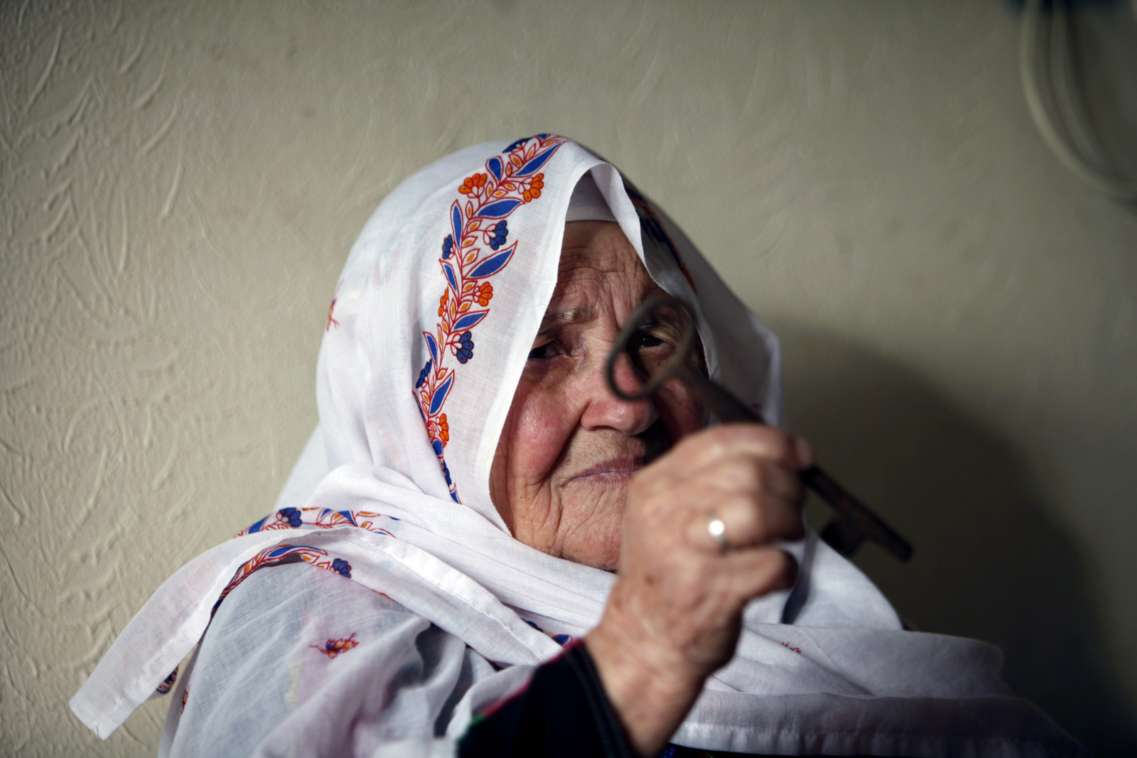 Azeza Abo Karesh, 83, a Palestinian refugee holds a key symbolizing the she was forced to flee in 1948, during the 65th anniversary of "Nakba", Arabic for catastrophe, the term used to mark the events leading to Israel's founding in 1948, at Shati refugee camp in Gaza City. (AP/Adel Hana)