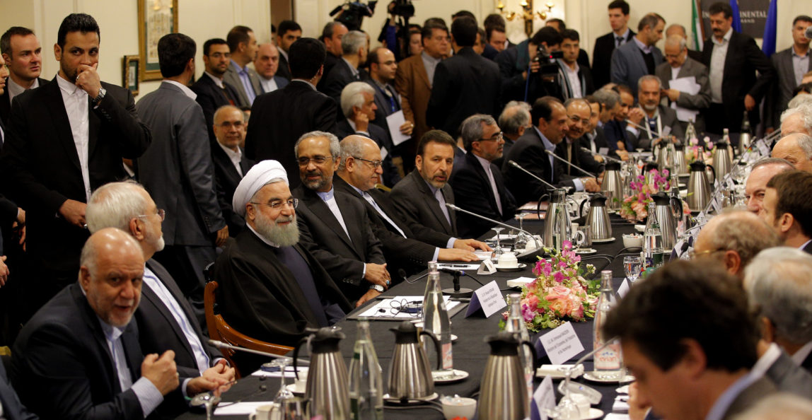 Iranian President Hassan Rouhani attends a meeting with Emmanuel Macron and French business leaders in Paris, Jan. 27, 2016. (AP/Christophe Ena)