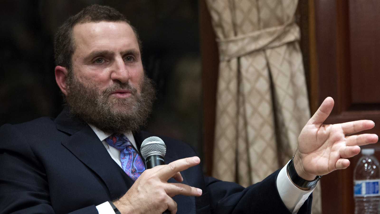 Rabbi Shmuel Boteach makes a remark while speaking to republican presidential candidate, New Jersey Gov. Chris Christie at the World Values Network headquarters, Jan. 7, 2016, in New York. (AP/Mary Altaffer)