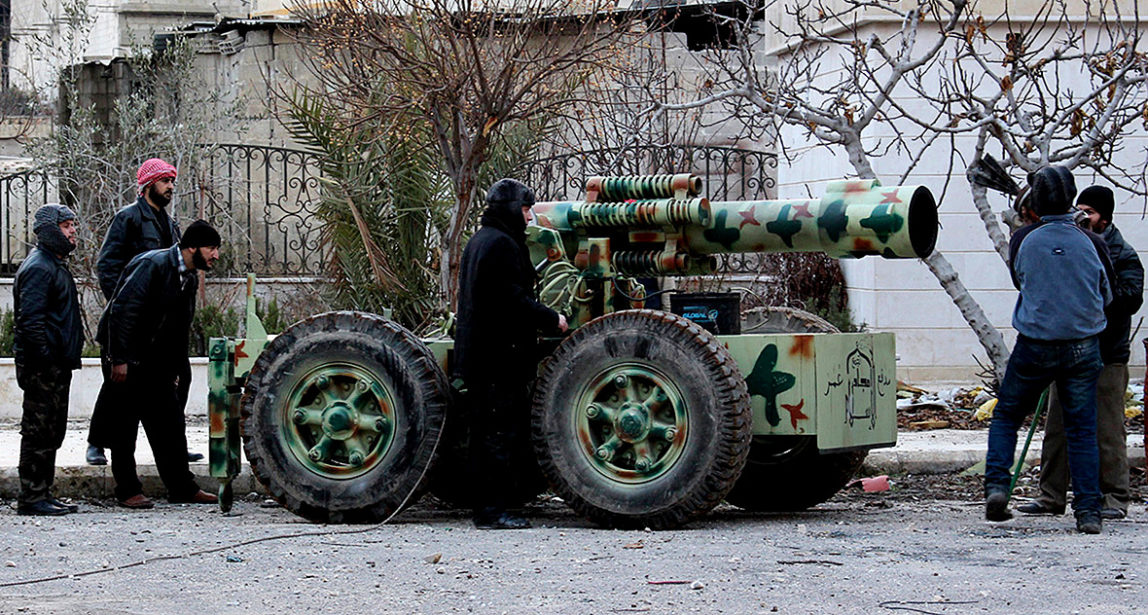 Fighters from the Amjad al-Islam brigades stand next to an improvised artillery weapon in eastern al-Ghouta. (Photo: Reuters)