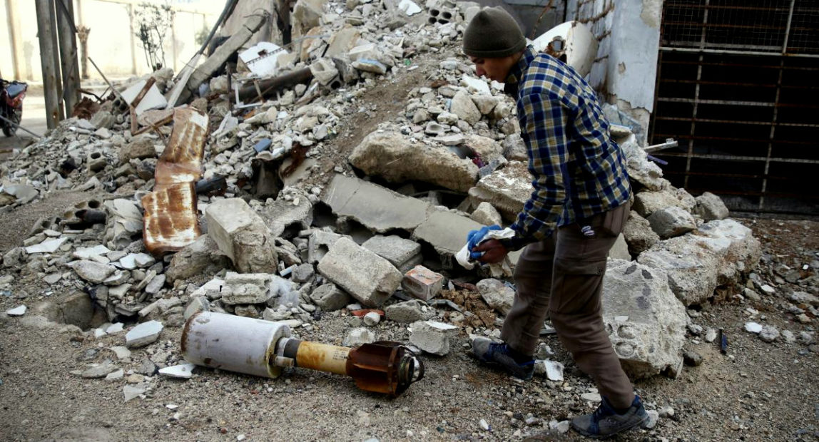 A man is seen near the remains of a homed-made rocket in Douma, Eastern Ghouta in Damascus, Syria January 22, 2018. (Photo: Bassam Khabieh/Reuters)