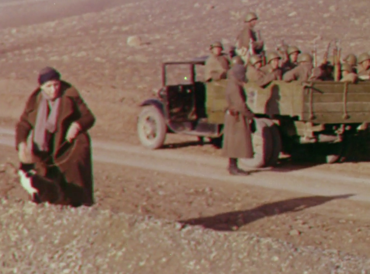 Mrs Skrine walks her cats, with the Red Army behind. As you do. Still from Quetta-Damghan. British Film Institute/Royal Geographical Society