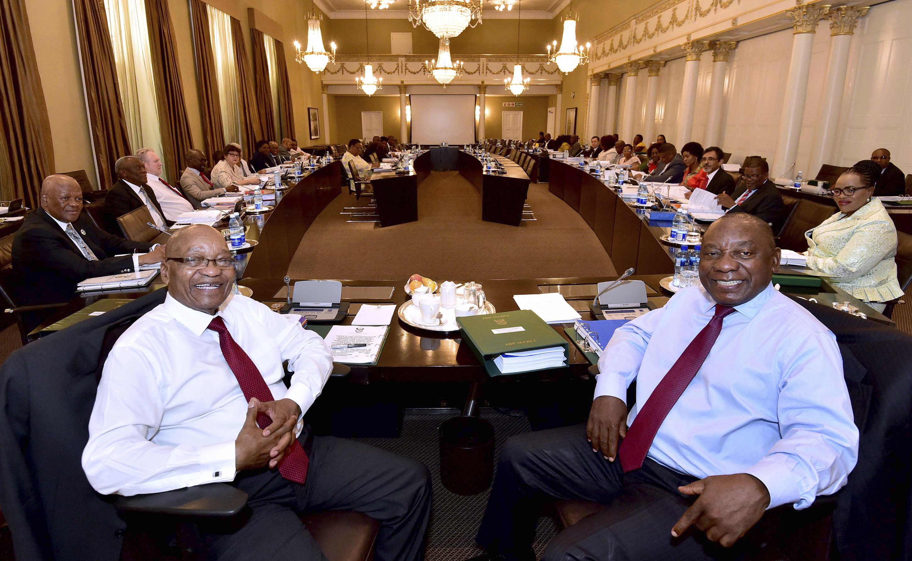 Former president Jacob Zuma, left, and then Deputy President Cyril Ramaphosa, right, with minsters and deputy ministers at a scheduled routine meeting of Cabinet Committees at parliament in Cape Town, South Africa, Feb. 7, 2018. (South African Government Communication and Information Services)