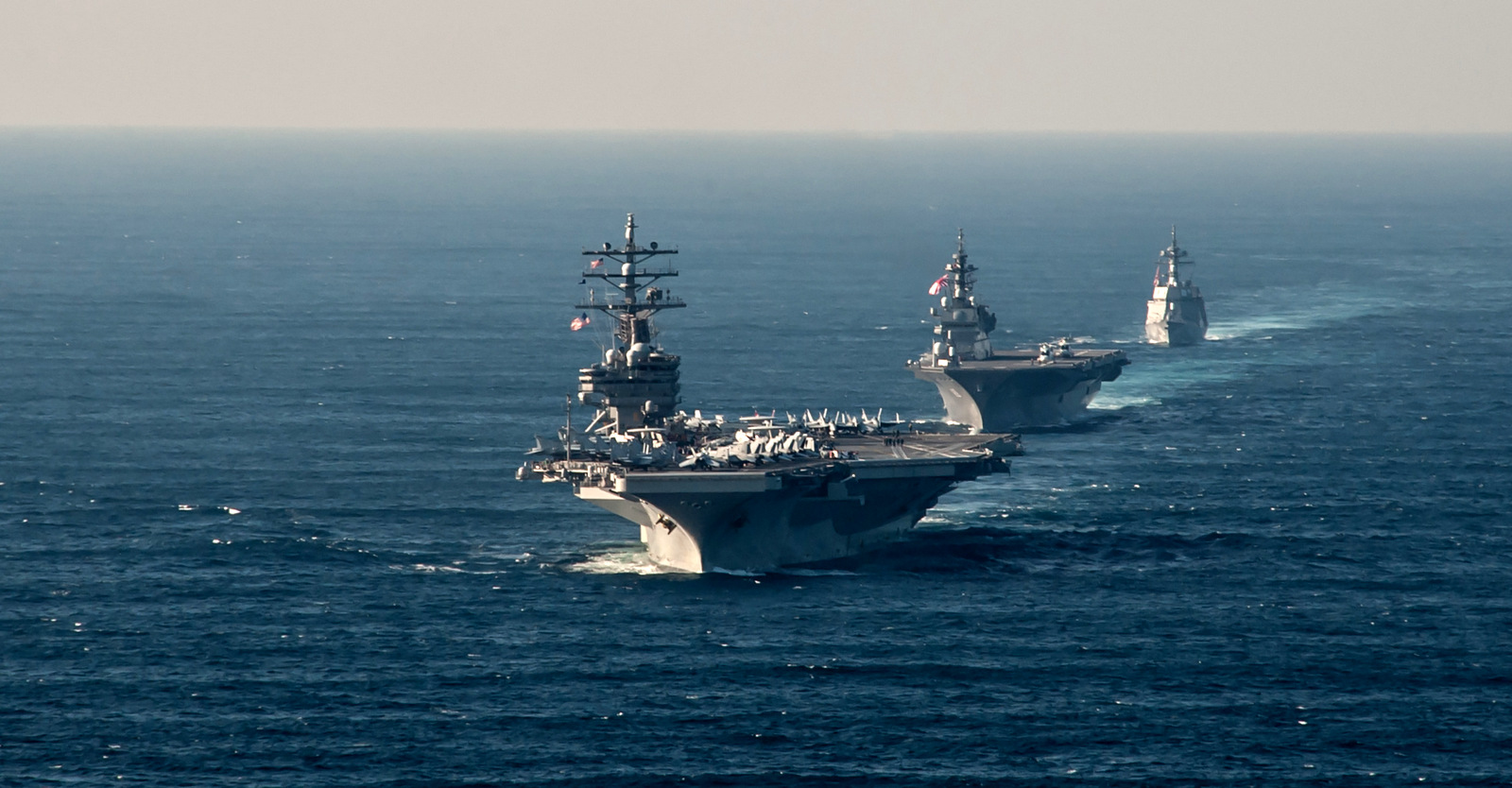 The U.S. Navy's Ronald Reagan steams alongside Japan's Izumo destroyer during an exercise off the coast of Japan,near the disputed South China Sea. (Photo: U.S. Navy )
