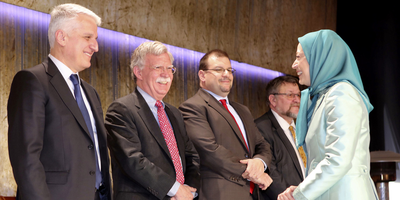 John Bolton, second left, with Maryam Rajavi, former leader of the MEK, pictured right, in Albania at a 2017 Nowruz celebration. (Photo: Siavosh Hosseini/NurPhoto)