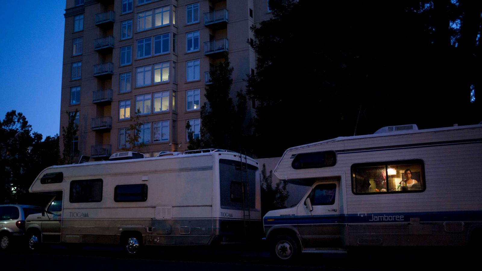 Delmi Ruiz, 41, who is five months pregnant, works in the kitchen area of her RV parked in front of an apartment building, where the monthly rent for a one-bedroom unit is more than $3,000; Monday, Oct. 23, 2017, in Mountain View, Calif. Ruiz and her husband, who works as a landscaper earning minimum wage, have been living in the RV for more than two years with their four children after they could no longer afford the rent. (AP Photo/Jae C. Hong)