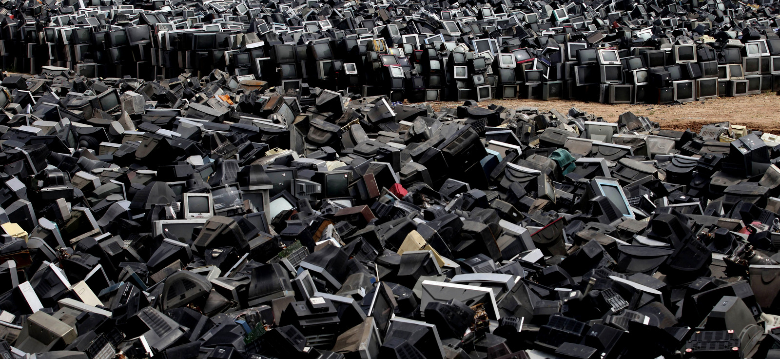 Discarded television sets pile up in a scrap yard awaiting recycling in Zhuzhou city in south China's Hunan province. (AP Photo)