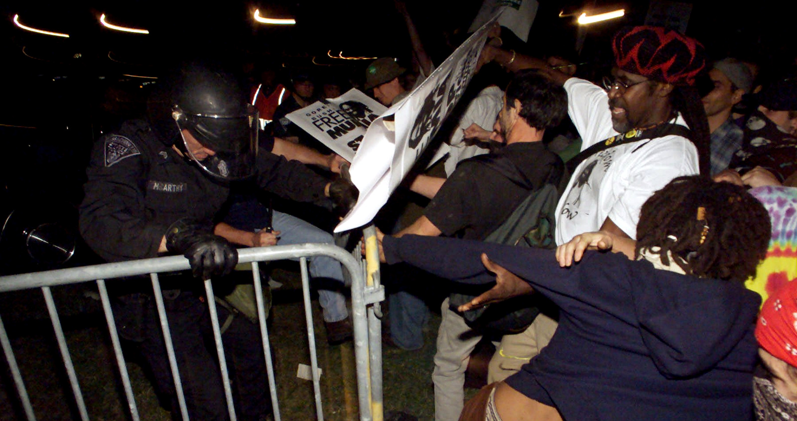 Massachusetts State Police confront demonstrators outside a presidential debate between Al Gore and George W. Bush at the University of Massachusetts in Boston, Oct. 3, 2000. (AP/Steven Senne)