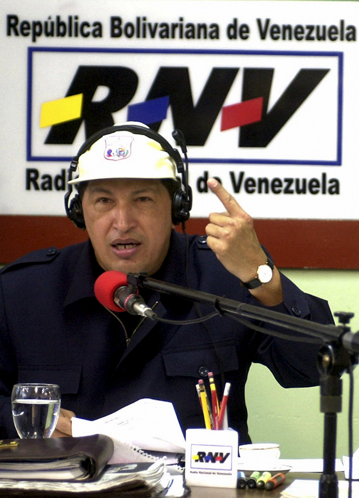 President Hugo Chavez smiles during his weekly radio show broadcast from San Sebastian de Los Reyes in the state of Aragua, Venezuela, June 10, 2001. Chavez's well publicized war with the news media is a staple of his "cadenas," or speeches, which by law must be broadcast by Venezuelan TV and radio, usually during prime time. (AP/Juan Carlos Solorzano)