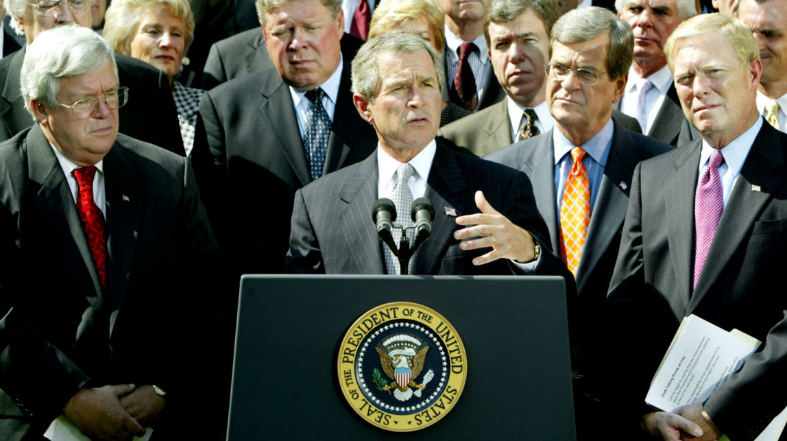 President Bush announces he has reached an agreement with House leaders on a resolution giving him authority to oust Saddam Hussein, in the Rose Garden, Wednesday, Oct 2, 2002. Bush is joined by, from left to right front row, Speaker of the House of Representatives Dennis Hastert, R-Ill, Bush, Sen. Trent Lott, R-Miss., and House Minority Leader Dick Gephardt, D-Mo. As part of the deal with the House, Bush bent to Democratic wishes and pledged to certify to Congress that diplomatic and other peaceful means alone are inadequate to protect Americans from Saddams weapons of mass destruction. (AP Photo/Ron Edmonds)